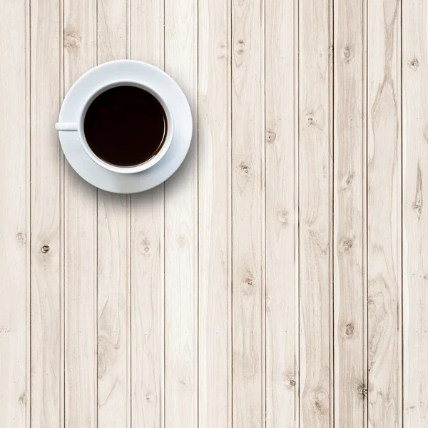 Taza de café blanco en la mesa de madera vista superior — Foto de Stock