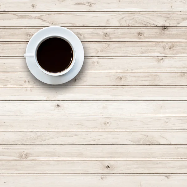 Taza de café blanco en la mesa de madera vista superior — Foto de Stock