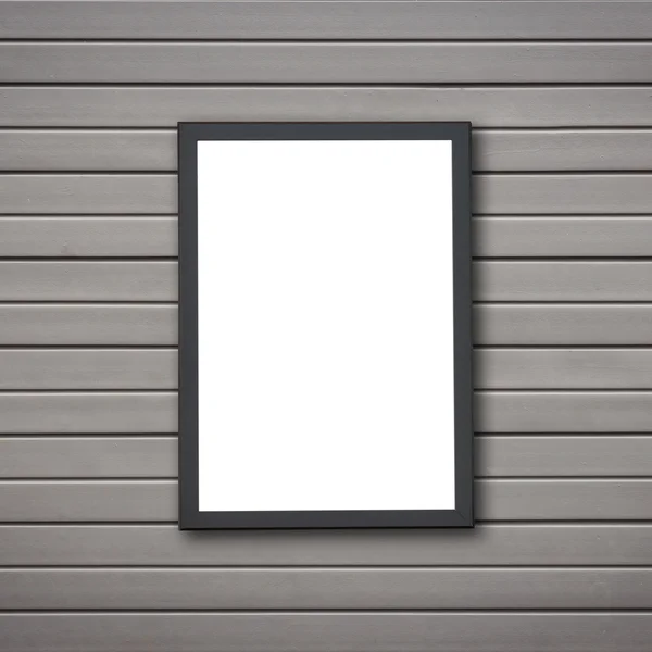 Blank of wooden photo frame on stone wall — Stock Photo, Image