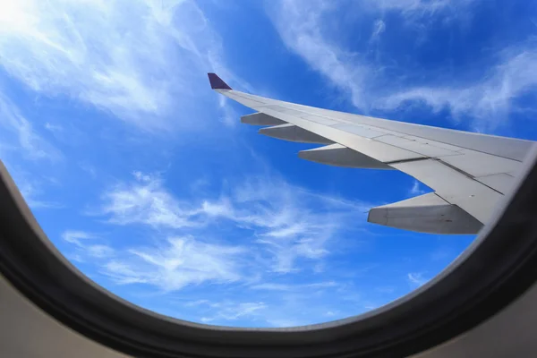 View of beautiful cloud and wing of airplane from window — Stock Photo, Image