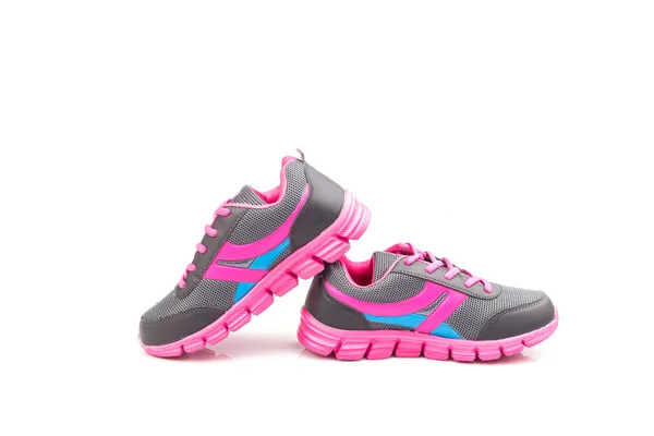 Розовая спортивная обувь на белом фоне — стоковое фото