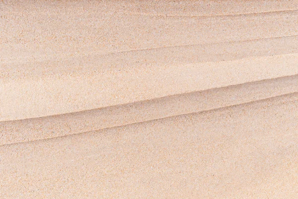 Abstracte helder zand textuur op het strand — Stockfoto
