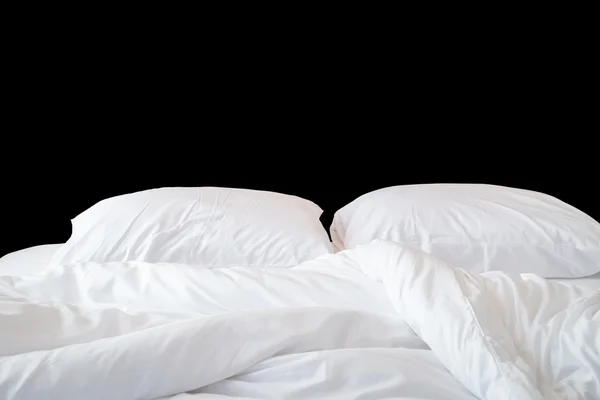 White bedding sheets and pillow isolated on black. Saved with cl