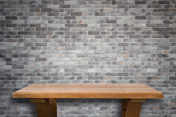 Empty top wooden shelves and stone wall background — Stock Photo, Image