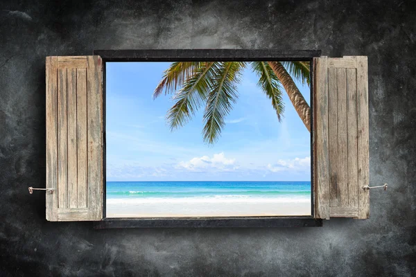 Old wooden windows frame on stone wall and view of the sea — Stock Photo, Image