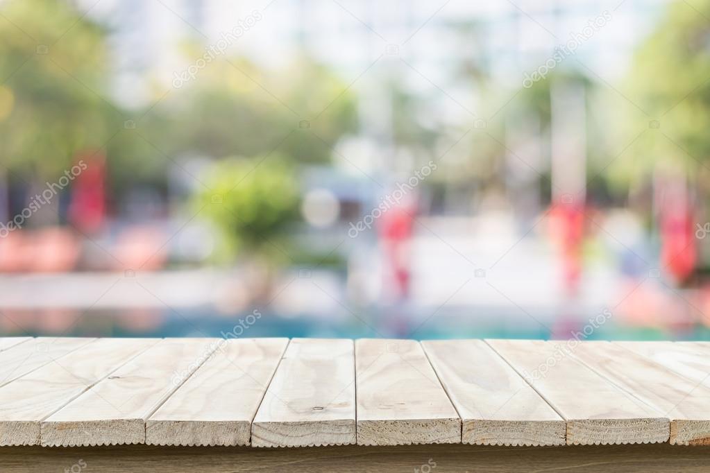 Empty top wooden table and sunny abstract blurred bokeh backgrou