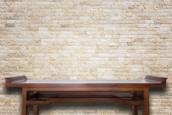 Empty top wooden table and natural stone wall background — Stock Photo, Image