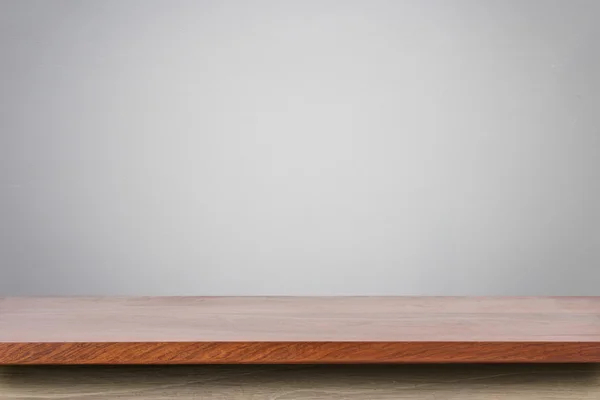 Tavolo vuoto superiore in legno e sfondo muro di pietra naturale — Foto Stock