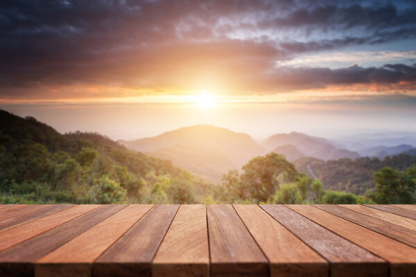 Empty top of wooden table or counter and view of landscape backg