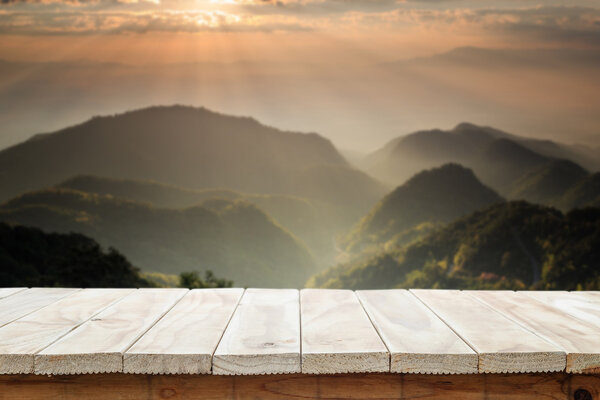 Empty top of wooden table or counter and view of landscape backg