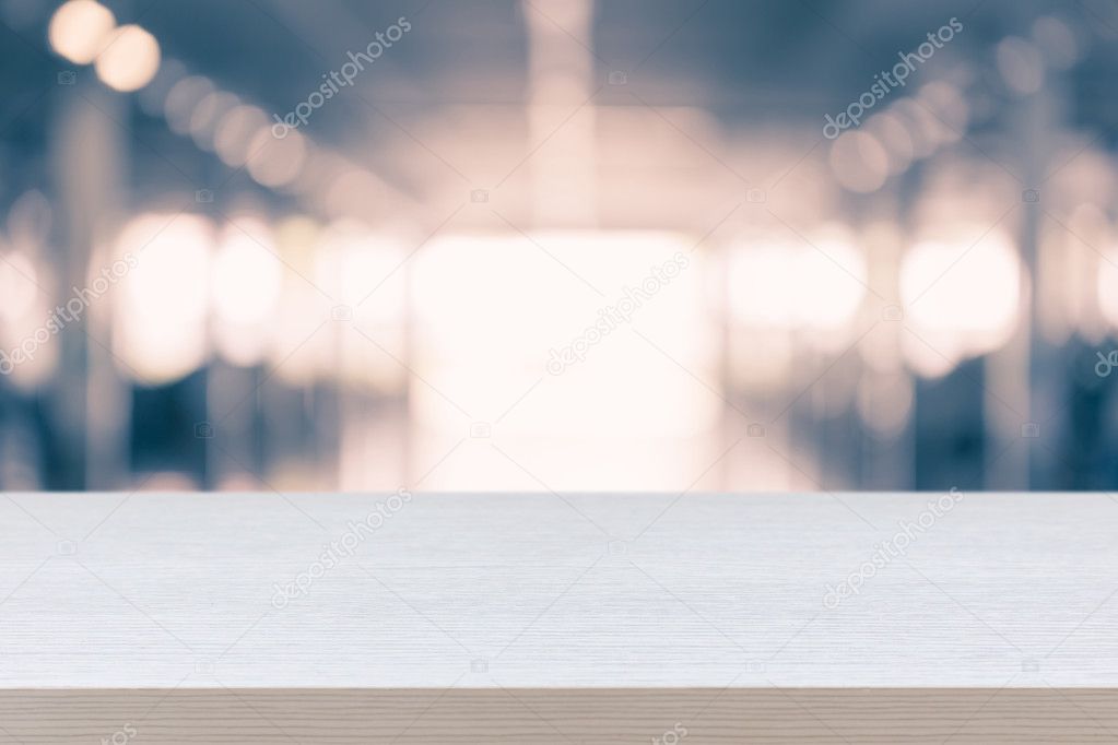 Empty top of wooden table or counter on blurred abstract backgro