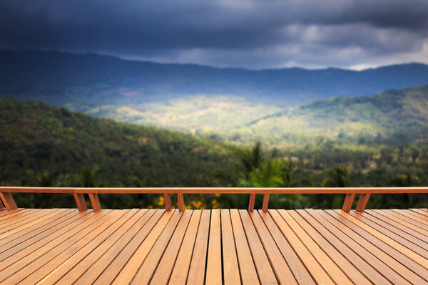 Wooden decking or flooring and view of mountain 