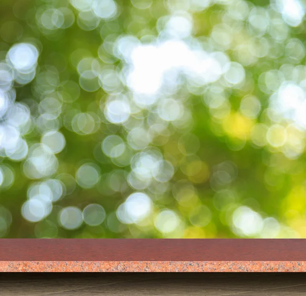 Parte superior vacía de mesa de piedra natural y abstracta borrosa con bokeh — Foto de Stock