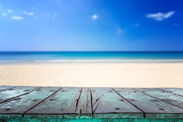 Empty top of wooden table and view of tropical beach Royalty Free Stock Images