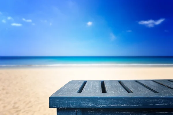 Empty top of wooden table and view of tropical beach Stock Photo