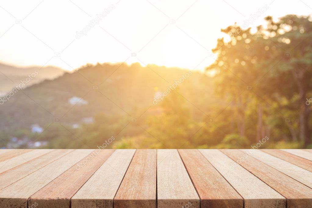 Empty top wooden table and sunny abstract blurred bokeh backgrou