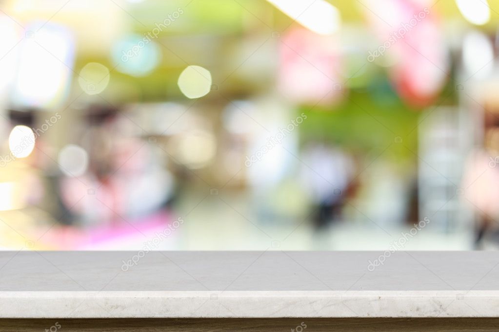 Empty top of natural stone table and blur with bokeh background 