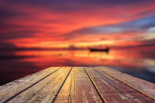 Top of old wooden table with blur sunset  background — Stock Photo, Image