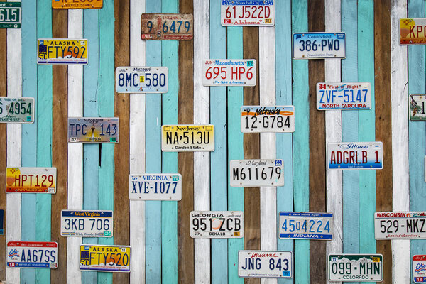 CHA AM THAILAND,  AUG 11, Old US car registration plate on wooden wall at the shop in Cha Am August 11, 14, Cha Am is a beach resort town in Phetchaburi Province, in the way to southern of Thailand