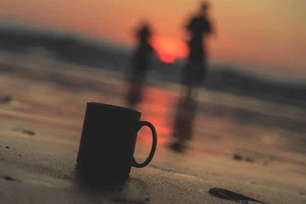 Tasse à café et coucher de soleil — Photo