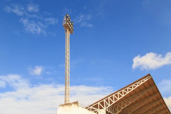 Spot light pole with blue sky in the stadium — Stock Photo, Image