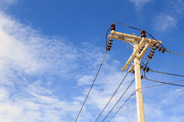 Electric pole power lines and wires with blue sky background — Stock Photo, Image