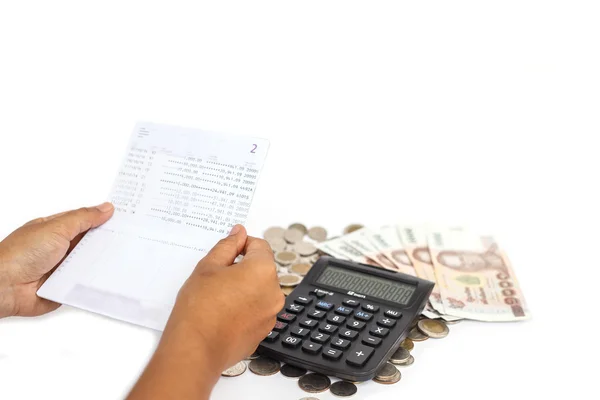 Hand holding book bank and stack of money in consept checking mo — Stock Photo, Image