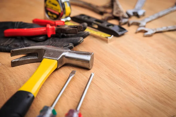 Closeup of assorted work tools on wood — Stock Photo, Image