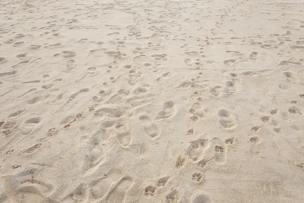 Textur des Sandes und Fußabdrücke im Sand — Stockfoto