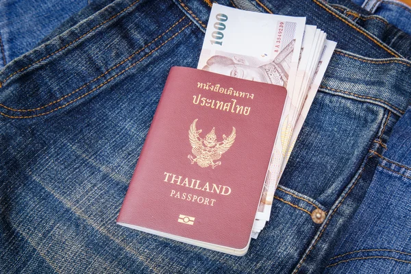 Thailand Passport and money in denim jeans pocket — Stock Photo, Image