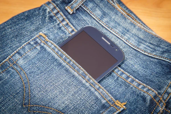 Close up smartphone in denim jeans pocket — Stock Photo, Image