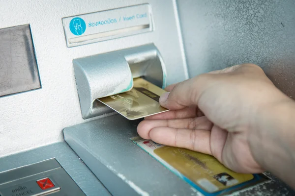Woman's hand using the ATM — Stock Photo, Image