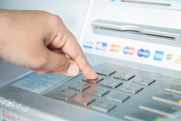 Close up of hand entering pass code on ATM bank machine keyp — Stock Photo, Image