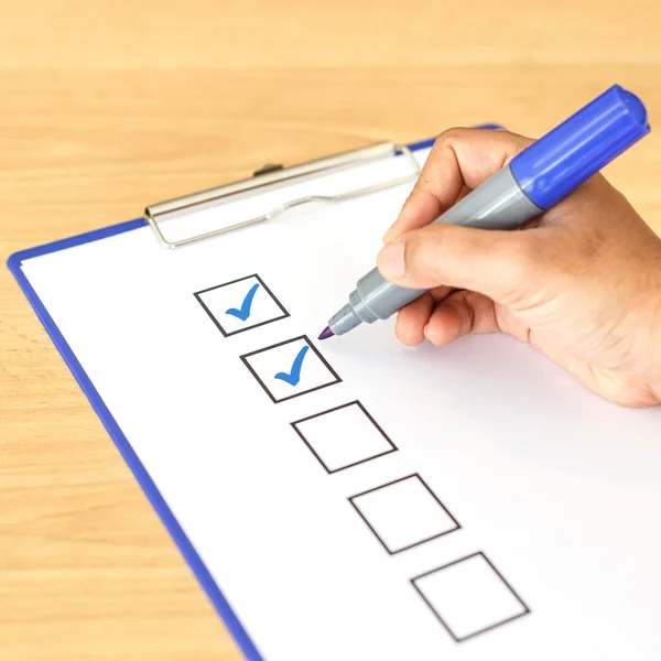 Hand writing on blank checkbox — Stock Photo, Image