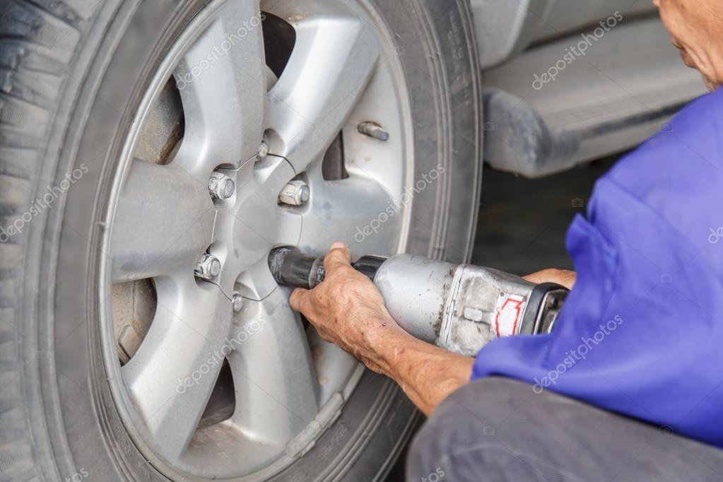 Man repair the tire Stock Photo by ©PhanuwatNandee 57493575