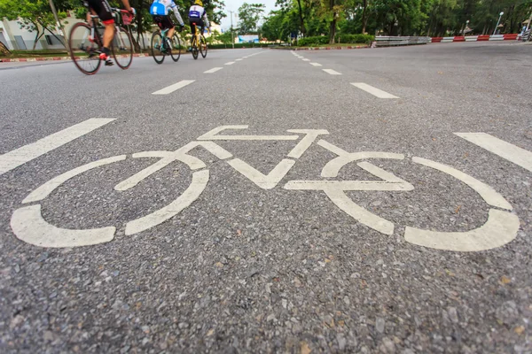 Bicycle sign or icon and movement  of cyclist in the park — Stock Photo, Image