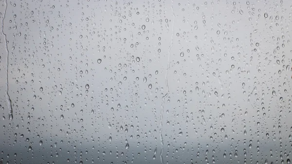 Drops of rain on windows glass surface — Stock Photo, Image