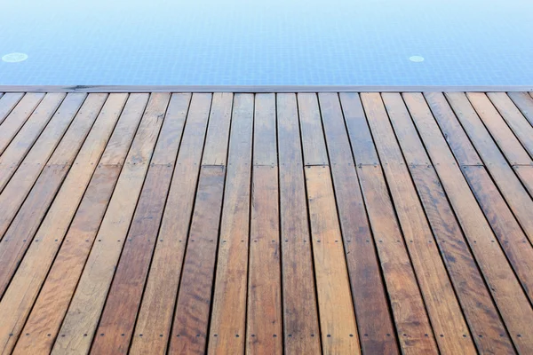 Wooden flooring beside the pool — Stock Photo, Image