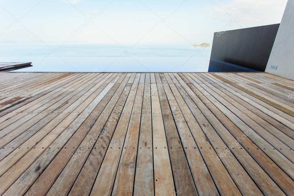 Wooden flooring beside the pool