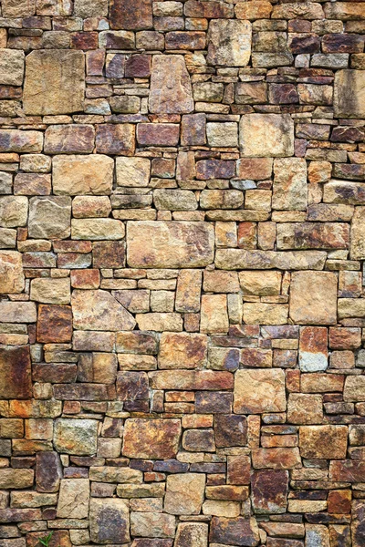 Textur der Natursteinwand für den Hintergrund — Stockfoto