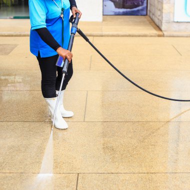 Floor cleaning with high pressure water jet clipart