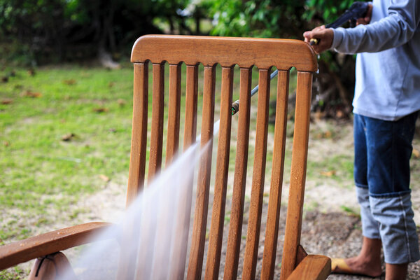 Wooden chair cleaning with high pressure water jet