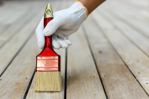 Pincel de mano y madera de pintura — Foto de Stock