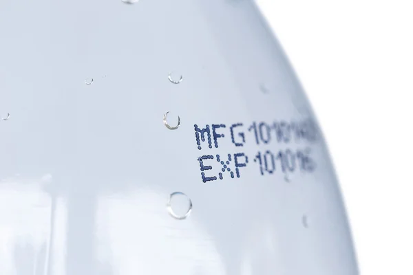 Close up expiration date on plastic bottle