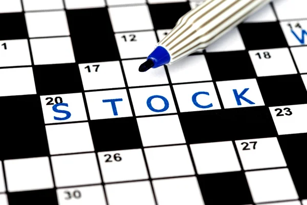 Stock in solving crossword puzzle, close up — Stock Photo, Image