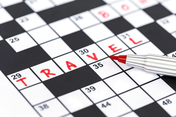 Close up red marker on Crossword - Travel — Stock Photo, Image