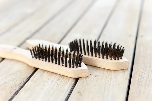 Steel brush on decking — Stock Photo, Image