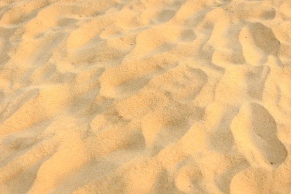 Texture of sand and footprints in the sand — Stock Photo, Image