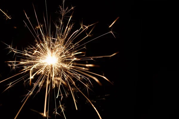 Christmas sparkler on black background — Stock Photo, Image