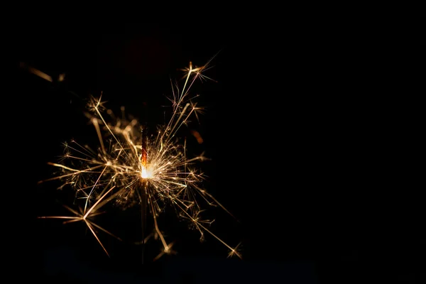 Christmas sparkler on black background — Stock Photo, Image